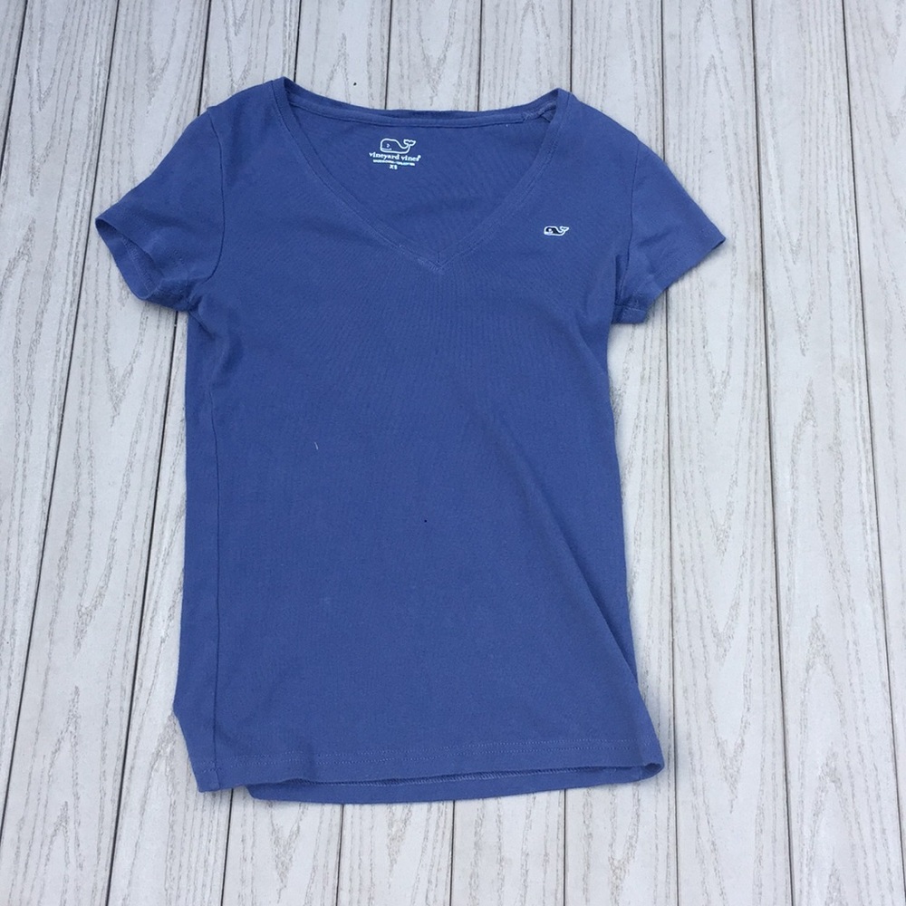 Short sleeved, purple-blue tee.